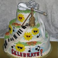 Celebrate! I was asked to create a cake for a newly married musical couple's celebration. The cake was frosted with buttercream icing. The banjo...