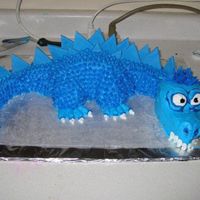 Dragon More of a Dragosaur, because we thought it looked like a cross between a dinosaur and dragon! It's my first dragon cake :) Chocolate...