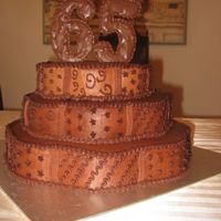 65Th B-Day Cake I made this cake for my fathers 65th b-day, bottom is white cake with lemon filling, middle is chocolate cake with caramel pudding and the...