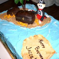 Pirate Birthday Dark chocolate cake with buttercream. Most of the decorations are fondant - except for the palm trees! Pirate taken from one of Debbie...