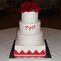 Wedding Cake iced in BC; red border is fondant