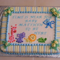 Safari Baby Shower Cake Marbled (vanilla and chocolate) flavor cake - all butter cream frosted cake - lettering, roses, stripes and animals are marshmellow fondant...