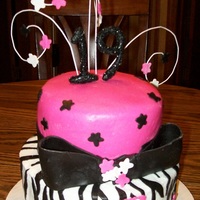 Zebra Print Hot pink fondant and zebra stripes for a 19 yr old friend of the family.