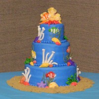 Dad's 80Th Birthday fondant covered and mostly handmade fondant decorations. Some of the shells are molded