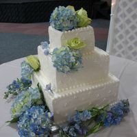 Square Wedding Cake White cake with buttercream frosting.