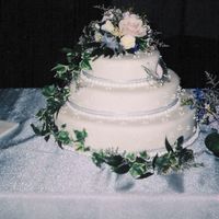 White Fondant Wedding Cake My first fondant wedding cake. Three stacked layers of carrot cake, coated in cream cheese icing, and white fondant. Decorated with royal...