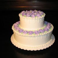 First Wedding Cake!! This is the first wedding cake I've done! yay! I'm so glad I made the roses ahead of time... it made completing the cake much...