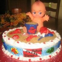 Beach Baby Diver Cake This cake was for a mom to be who loves to dive. Cake is frosted with buttercream. Animals and shells are all of MMF. Sand is raw sugar.
