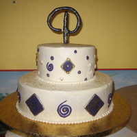 Tiered Purple And Gold Cake With Monogram I made this cake for my husband's grandmother. Her name is Pearlie so I made a P monogram to put on top. All the decorations are made...