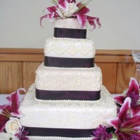 Baywood pink chapagne, triple chocolate, toffee chip, white chocolate raspberry cake, with butter cream and MMF. Real flowers and ribbon