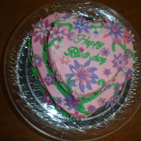 Cake For Mom This is a cake I helpped my neices make for their Mom's birthday. They made all the flowers and did all the piping. She loved it!