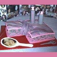Andrea this cake for a cosmetolgist graduation features her reversed image on the fondant/bc mirror along with the scissors, shampoo, conditioner...