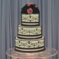 First Practice Wedding Cake Done at the wilton school in chicago. The gumpaste roses were my fav part of the cake.