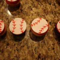 Baseball Cupcakes yellow and chocolate cupcakes with buttercream frosting and fondant cut out circles with royal icing stitching