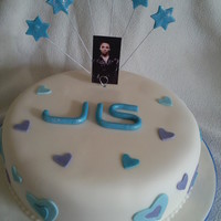 Jls Cake Vanilla sponge covered with sugarpaste. Flowerpaste stars.