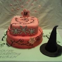 Wicked Themed Cake Inspired by the theatre production. 2 fruit cakes covered with marzipan and fondant.. The black vines are painted on, the sparkly windmills...