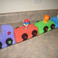 Backyardigan Circus Train Birthday Cake Made from 4 pound cakes and Buttercream icing. I used Backyardigan bobble head circus toys on each car and caboose and a #2 candle for the...