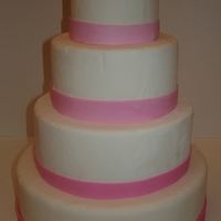 Shades Of Pink Fondant wedding ckae dummy with graduating shades of pink fondant ribbon.