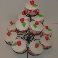 Valentine's Day Cupcakes First time I used my cupcake stand. Cupcakes are covered in mmf and have mmf roses.