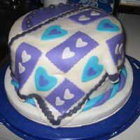 Quilt Fondant Cake MMF decorations over a almond cream cheese pound cake frosted with cream cheese buttercream frosting. Cake was made for a fondant class I...