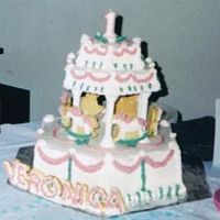 Carousel Birthday Cake First birthday cake for my daughter. Huxagon pans, all buttercream frosting, white/yellow cake. My first attempt at a tier cake.