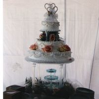 Peach Roses This is by far my most favorite wedding cake that I have ever done. The peach and turquoise colors together looked to nice. Just one easy...