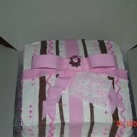 Present Cake The bow and tag is fondant and the rest is buttercream. The colors are pink and brown. This was my first present cake. The lines are...