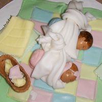 Stork Delivery: It's Twins! These little guys are made from fondant and gum-tex. I used my fingers to shape the head and eyes, then used a toothpick to make everything...