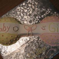 Baby Girl Rattle Cake I made this for my neighbor who found a pic for me to look at and do. I used my soccerball (half) and a square sheet to make the shape of...