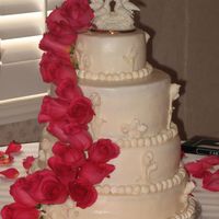 Cascade Wedding cake for 150. Used a figure groom gave bride in 1999 as their topper. TFL