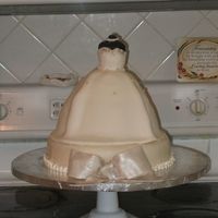 Wedding Dress Cake This was made for a bride getting married in August. It was a Strawberry cake with a cream cheese frosting/filling. TFL