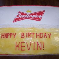 Budweiser Cake My first birthday cake for someone else. You can tell with my writing, lol. The "beer" is colored piping gel. I sprinkled white...
