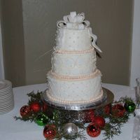 First Wedding Cake First wedding cake made for coworker friend. Small wedding so I agreed to attempt it. Thanks to cakesbyallison for her design, help and...