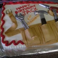 Tool Belt Birthday Cake Yellow sheet cake. Fondant tool belt; candy melt tools "painted" with silver.