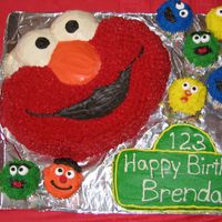 Elmo And Sesame Street Characters Hi all! This was for my son's 2nd birthday. Elmo is from the Wilton pan and is all buttercream. I carved the Sesame St sign out of a 9...