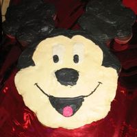 1St Cupcake Cake For my daughters (who is obsessed with mickey mouse clubhouse) 2nd birthday. Couldn't get the icing smooth and started to run out of...