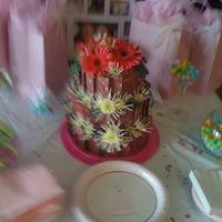 May2008_089.jpg Chocolate shards with pink swirls surround the cake with fresh flowers