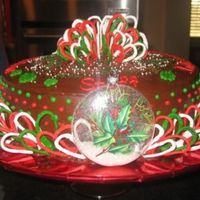 Christmas Cake Chocolate cake with hershey chocolate filling and icing. Royal icing loops were made to surround the cake and make a bow on top. First cake...
