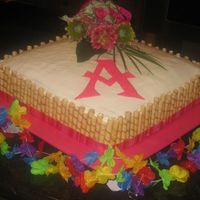 Grauduation Cake b/c icing with strawberry filling and white cake.