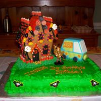 Haunted Birthday My 5 year old son designed this cake. The haunted house is the Wilton Halloween gingerbread kit. The mystery machine is fondant over...