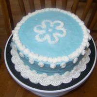 100_0505.jpg I decided to make a cake today to just tring to get in more practice. Rosette border with star tip 18 flower. I used a cookie cutter for...