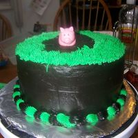 Pig In The Mud Chocolate cake with chocolate buttercream and fondant piggy bank. I got the pig off somewhere on here, but i cannot remeber where.