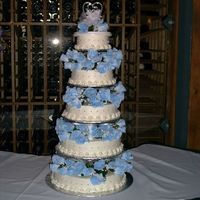 Roses In Blue A five tiered (6-8-10-12-14) multi-battered cake french vanilla, chocolate and combination of both.