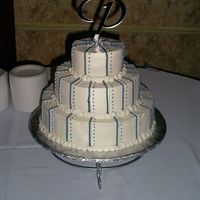 Winter Wedding Blue and white wedding cake with stripes make with french vanilla batter and buttercream icing for my best friend's daughter.