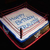 Wrestling Ring I made this for my hubby on his birthday. Its a layer of choc. cake and a layer of vanilla. All iced in BC. Wooden dowels and red ribbon...
