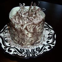 Chocolate Wrap This was a yellow cake with BC frosting and filling. Then i put a white chocolate wrap around it using transfer paper for the marbleized...