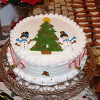 Merry Christmas To All This cake was one of the most detailed cakes I have ever done. It might be hard to see but there is gingerbread men, candy canes, and holly...