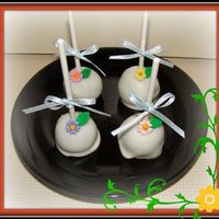 Cute Cake Balls Pops Chocolate cake balls dip in white chocolate with fondand flowers