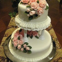 Final Cake Wilton Course 3 This is a two tiered 6x4 chocolate cake with hazelnut filling, 10x4 butter pecan cake with pecan filling, covered with fondant and fondant...