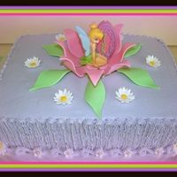 Tinkerbell In Flower 9X13X4 Buttercream icing with fondand flowers.